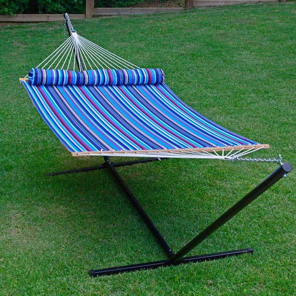 Multiple color striped 13 foot quilted hammock with matching pillow on grass