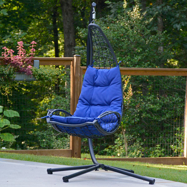 Blue Cushioned Rattan Wicker-Hanging Chair with Stand on Patio