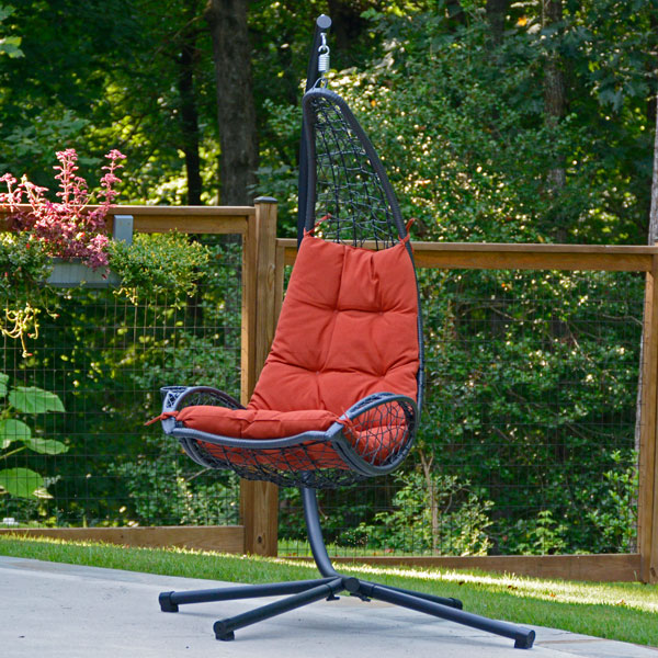 Red Cushioned Rattan Wicker-Hanging Chair with Stand on Patio