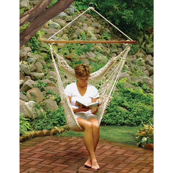 Women Sitting in Hanging Cotton Rope Chair